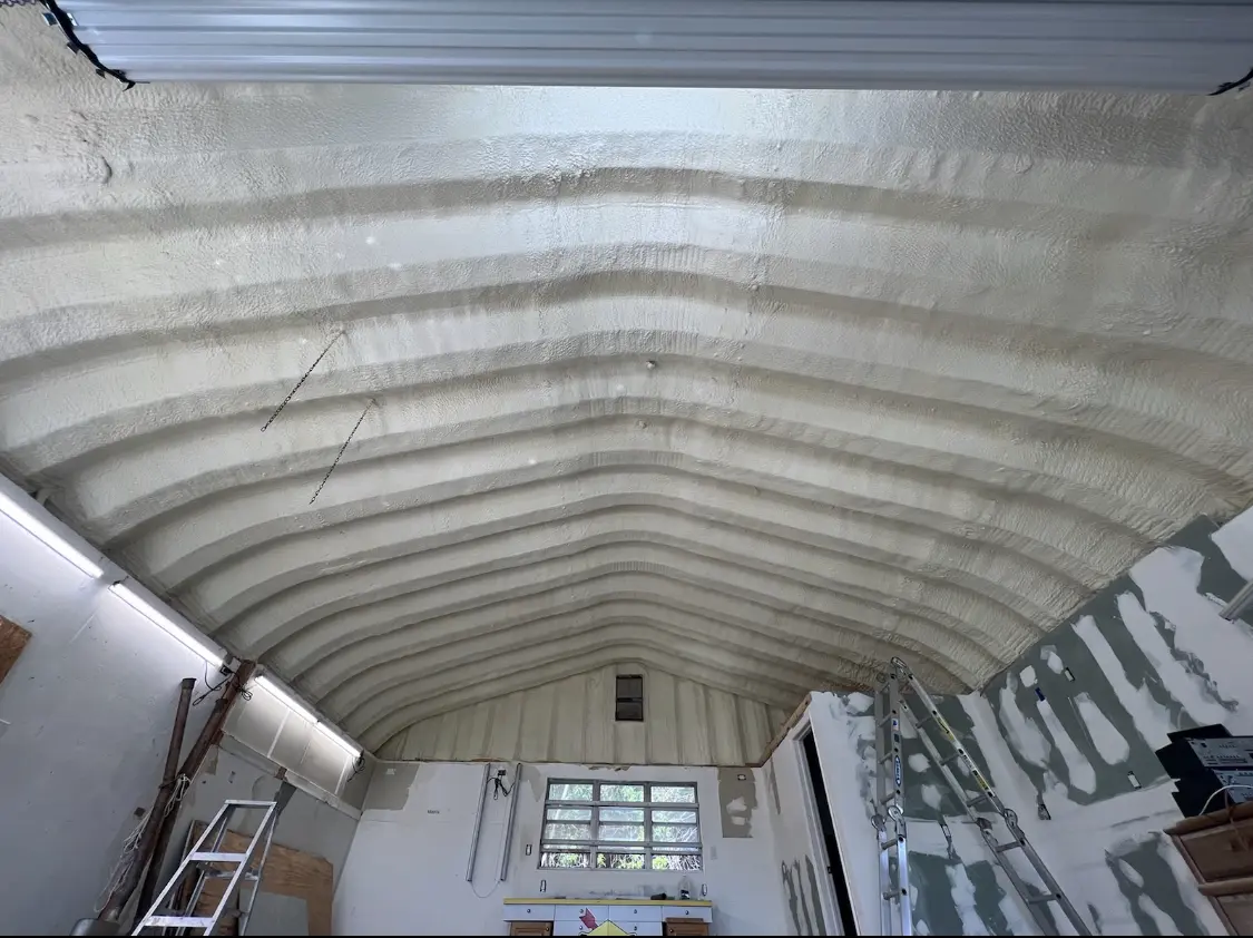 Spray polyurethane foam applied to the underside of a metal roof deck in Port Salerno